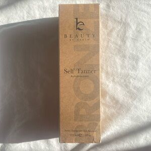 Unopened Beauty by Earth self tanner lotion in shade medium to dark.